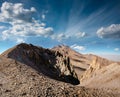 Amazing panoramic landscape of Mount Erciyes. View of the an inactive volcano: mountain range, stony slopes, rocky peaks formed by Royalty Free Stock Photo