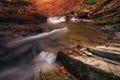 Amazing panoramic landscape mountain river in autumn forest at sunlight. View of stone water rapids and small waterfall. Royalty Free Stock Photo