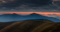 Amazing panoramic mountains landscape at dawn. View of dramatic morning sky and mountain ridges and slopes. Royalty Free Stock Photo