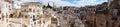 Amazing panoramic view from a balcony of typical stones Sassi di Matera and church of Matera UNESCO European Capital of Culture Royalty Free Stock Photo