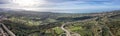 Panoramic view from a drone of a landscape with part of a road junction near the sea