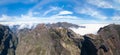 Amazing panoramic view at the top at the mountains Pico do Areeiro and Pico Ruivo, low clouds, Madeira Island, Portugal Royalty Free Stock Photo