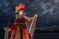 Amazing performer with beautiful costume and venetian mask during venice carnival Royalty Free Stock Photo