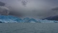 The amazing Perito Moreno glacier. A wall of blue ice over a turquoise glacial lake. Royalty Free Stock Photo