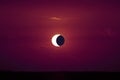 amazing phenomenon of sun eclipse over cloud sunset red orange sky Royalty Free Stock Photo