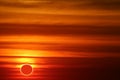 amazing phenomenon of total sun eclipse over cloud sunset orange sky Royalty Free Stock Photo