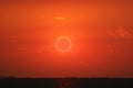 amazing phenomenon of total sun eclipse over cloud sunset red orange sky on the sea Royalty Free Stock Photo