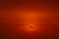 amazing phenomenon of total sun eclipse over cloud sunset red orange sky on the sea Royalty Free Stock Photo