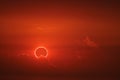 amazing phenomenon of total sun eclipse over cloud sunset red orange sky on the sea Royalty Free Stock Photo