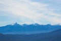 Amazing pictorial landscape of snow-covered mountains under boundless blue sky