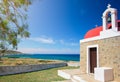 Amazing pictorial view of an old stone church beside blue sea, Milatos, Crete.