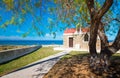 Amazing pictorial view of an old stone church beside blue sea, Milatos, Crete.