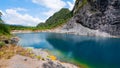 Amazing pond in tropical rainforest forest with mountain rocks peak Beautiful water surface in Phang Nga Thailand