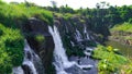 Amazing Pongour waterfall in Vietnam, Da Lat with the Buddha on the top.