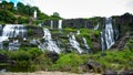 Amazing Pongour waterfall in Vietnam, Da Lat with the Buddha on the top.