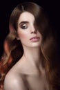 Amazing portrait of a girl. Hairdo hollywood waves. Looking away