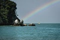 Amazing rainbow at Split Apple Rock, a rock formation in the ocean in Abel Tasman National Park, New Zealand Royalty Free Stock Photo