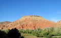 Amazing red mountain and green froest at the bottom Royalty Free Stock Photo