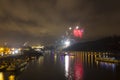 Amazing red and yellow firework celebration of the new year 2015 in Prague with the historic city in the background Royalty Free Stock Photo