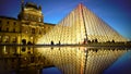 Amazing reflection of illuminated Louvre Pyramid in water, Paris sights at night