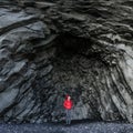 Amazing rocks in iceland and woman torist inside