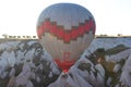 Hot air balloons fly in clear morning sky near Goreme, Kapadokya