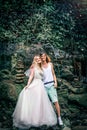 Amazing romantic view of happy couple in the rainforest of Bali island close to waterfall. Royalty Free Stock Photo