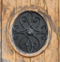 Detail round iron window on door