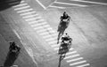 Amazing scene from high view, shadow people ride motorbikes on road surface Royalty Free Stock Photo