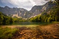 Amazing scenery under the huge mountains. Glaciers cover with snow and unique magical lake.