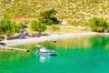 Amazing sea bay on Greek Island with fishing boat Royalty Free Stock Photo