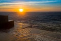 Amazing Sea sunset at the stone pier in calm weather. Nature. Royalty Free Stock Photo