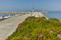 Amazing Seascape with Spring flowers and pier in Skala Sotiros, Thassos island, Greece