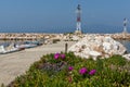 Amazing Seascape with Spring flowers and pier in Skala Sotiros, Thassos island, Greece