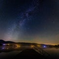 Amazing shot of a beautiful starry sky over a lake Royalty Free Stock Photo