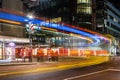 Amazing shot of a busy city intersection with neon lights at night Royalty Free Stock Photo