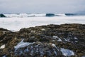 Amazing shot of a rocky beach on a blue and white seascape background Royalty Free Stock Photo