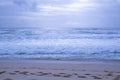 Amazing shot of a sandy beach on a cloudy sky background Royalty Free Stock Photo