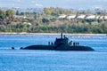 An amazing shot of a submarine emerging to the surface