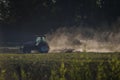 Amazing shot of a tractor working in a farmland Royalty Free Stock Photo