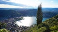 Amazing sight of Lake Como from Brunate, panoramic view of the lake and the city of Como with sun rays reflecting on the surface