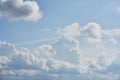 Huge clouds in the blue sky as background. Amazing skies and clouds