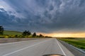 Amazing sky above the long road at sunset Royalty Free Stock Photo