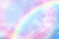 Amazing sky with rainbow and fluffy clouds, toned in unicorn colors