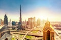 Amazing skyline cityscape with modern skyscrapers. Downtown of Dubai at sunny day during sunrise, United Arab Emirates