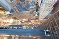 Amazing skyscrapers in Midtown Manhattan, aerial view from rooftop with traffic reflections on the buildings at night Royalty Free Stock Photo