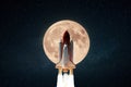 Amazing space shuttle rocket with blast successfully takes off into the starry sky with a big full moon. The beginning of the