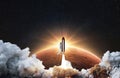 Amazing spacecraft with blastoff and cloud of smoke successfully take off and explore space with red planet mars in sunrise rays. Royalty Free Stock Photo