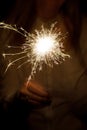 Amazing sparklers in female hands. Christmas and new year sparkler in hand toning. Royalty Free Stock Photo