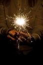 Amazing sparklers in female hands. Christmas and new year sparkler in hand toning. Royalty Free Stock Photo